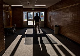 Young checks the doors to make sure they're locked at Vernal Middle School in Utah.